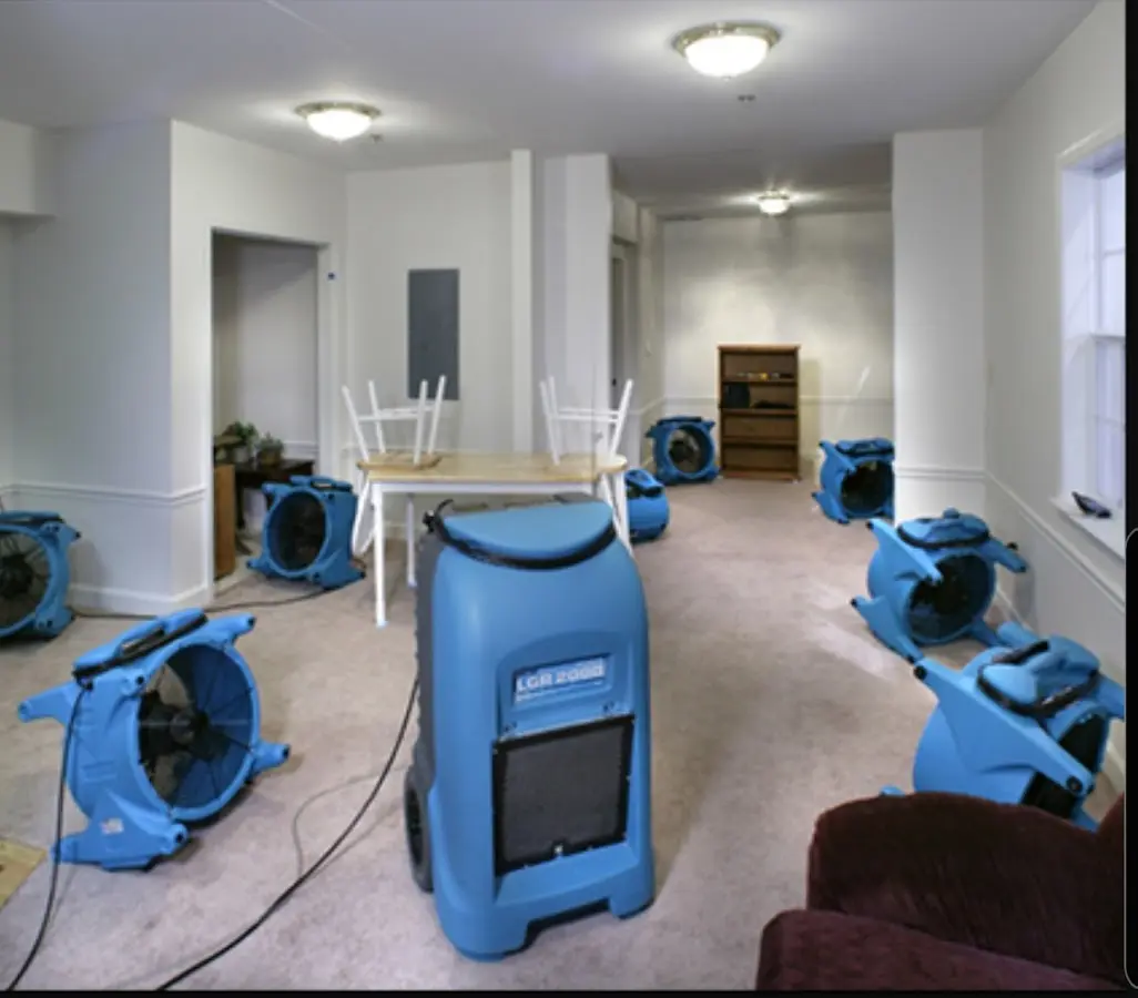 Air movers and dehumidifier setup for Water Damage Restoration in Howland Center